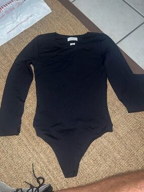 Kids Black Long-Sleeve One-Piece Bodysuit by Babaton Contour